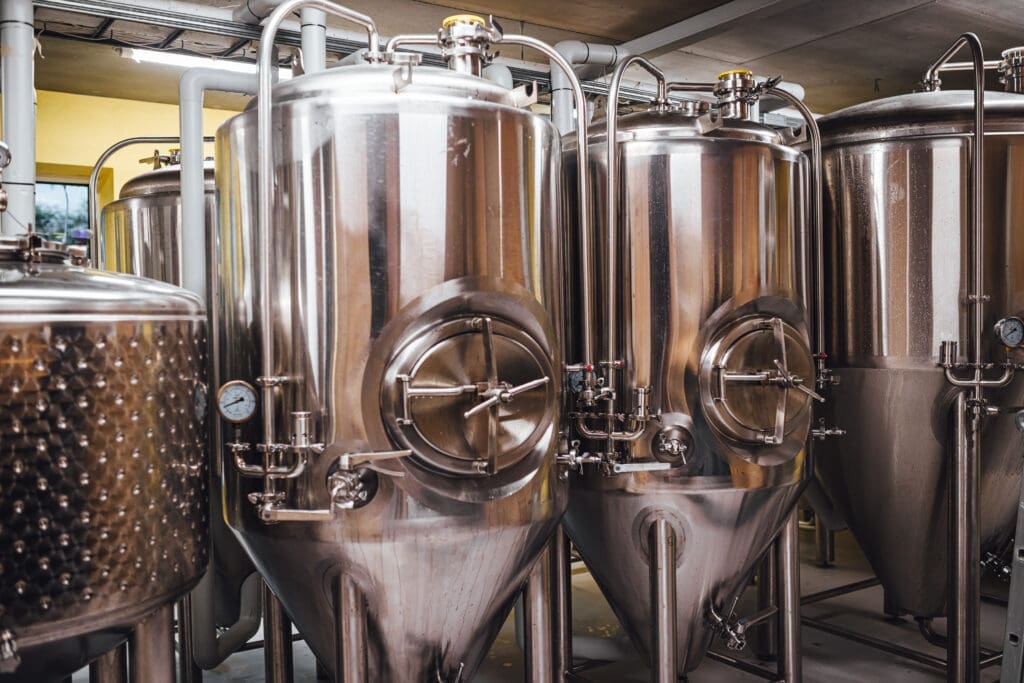 Craft beer equipment in brewery.